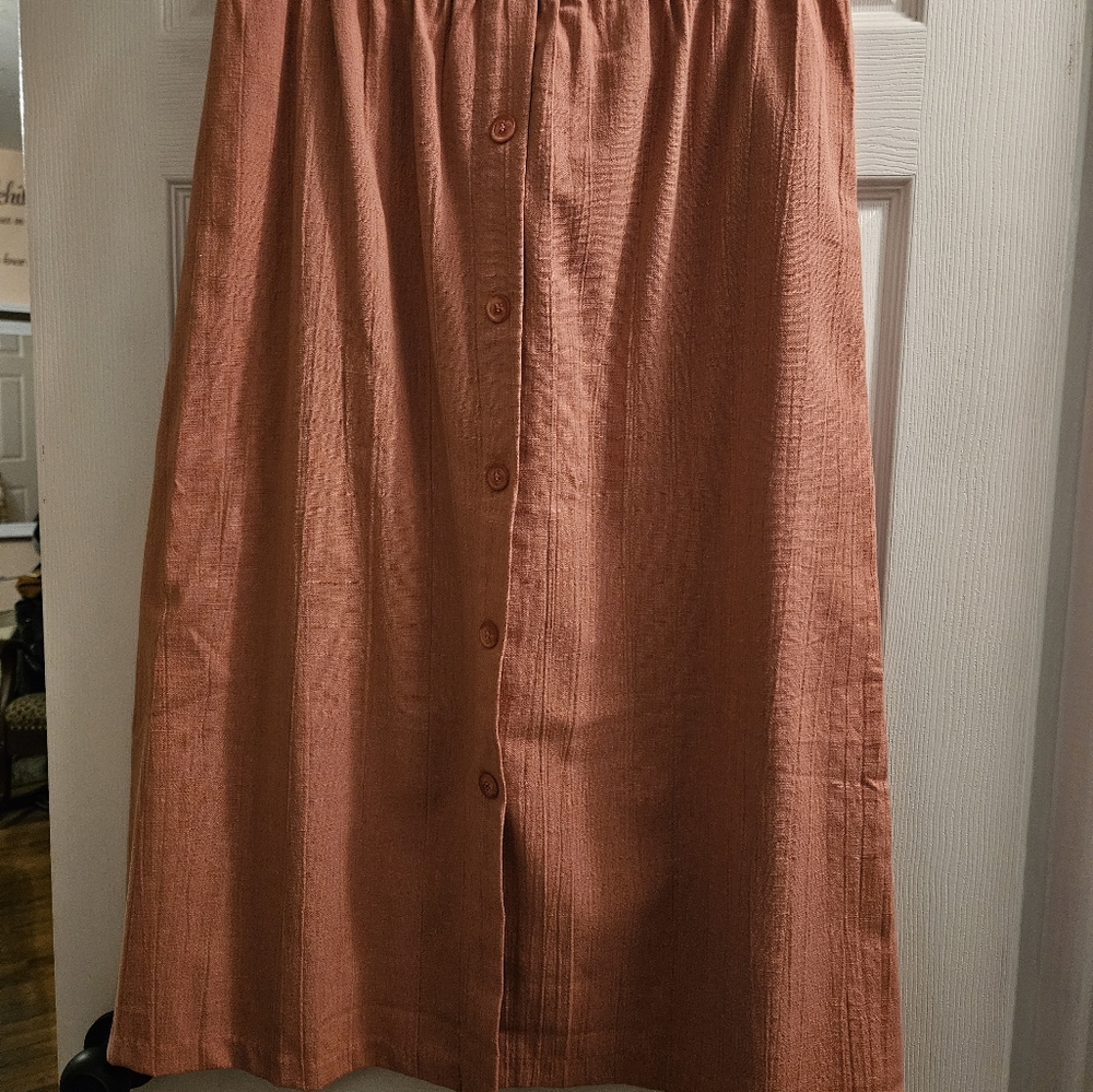 Rose colored button front skirt.